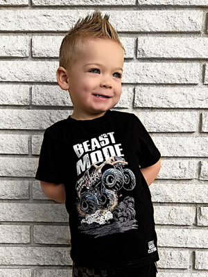 toddler boy wearing black kids graphic t-shirt with monster truck featuring the text beast mode, little rocker clothing rock style outfit 