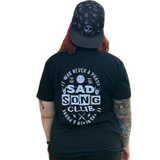 women wearing a black graphic t-shirt with sad song club, little rocker clothing rock style outfit for kids and adults