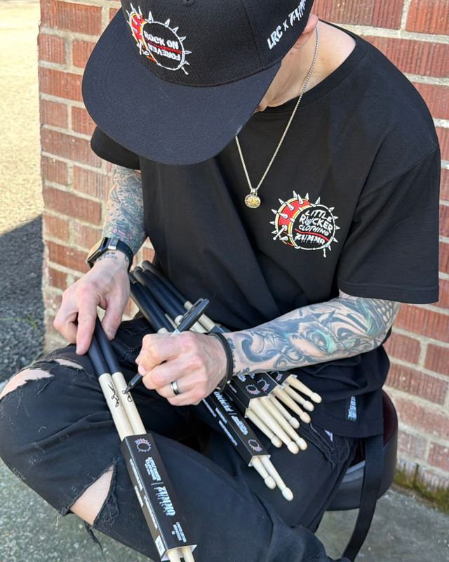 Frank Zummo Autographing little rocker clothing drumsticks