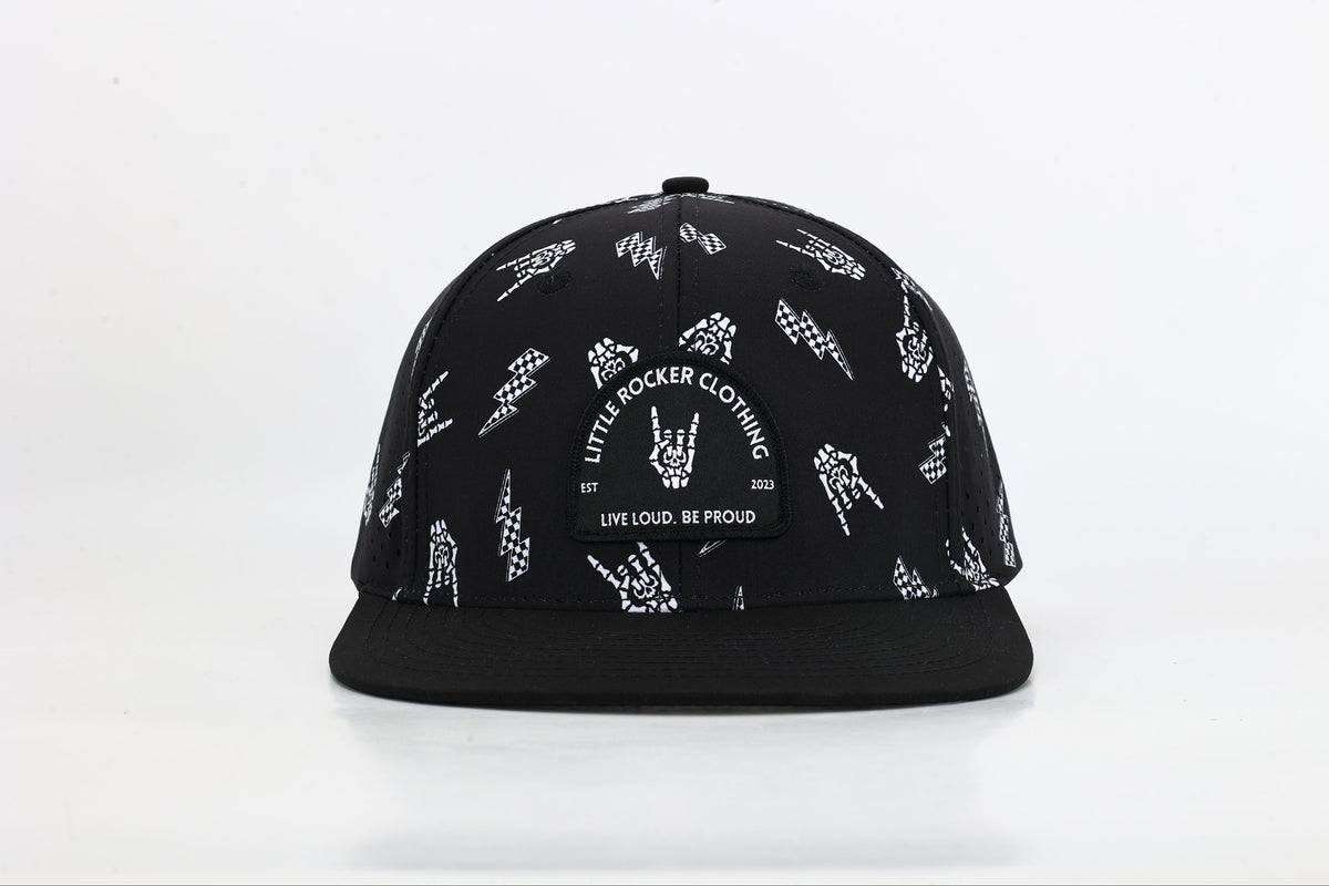 close up black snapback hat with allover bolted bones lightning bolt and rock hand print little rocker clothing patch flat brim adjustable cap for kids and adults