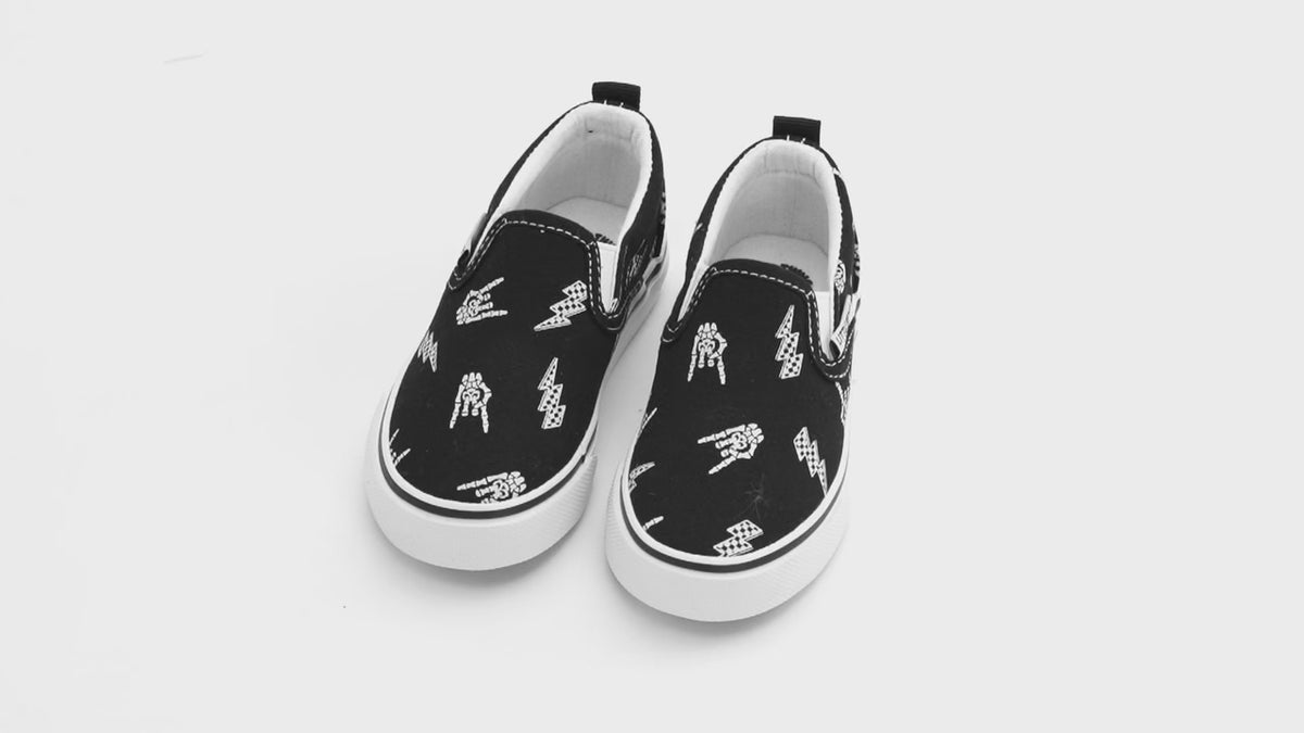 overview video of the bolted bones canvas slip on shoes for kids with black  elastic slip on design, little rocker clothing footwear