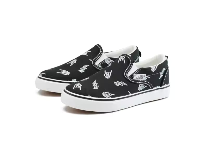 Side image of bolted bones canvas slip on shoes black and white rocker sneakers outfit