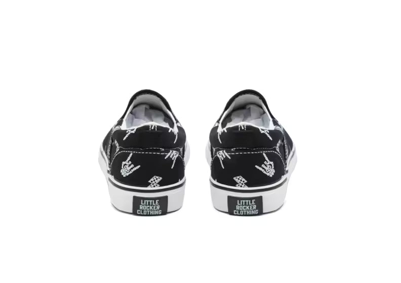 back side of the bolted bones canvas slip on shoes for kids with black and white skull and lightening bolt pattern, rocker style kids sneakers